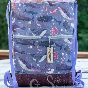 Something Snappy Whale Song (in lavender) Drawstring Backpack